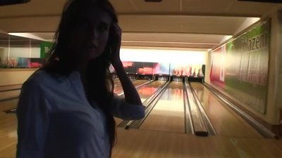 A couple from Czech spends time in bowling. Guy films girlfriend throwing balls. The girl is glad but the most good pont of time of the evening
